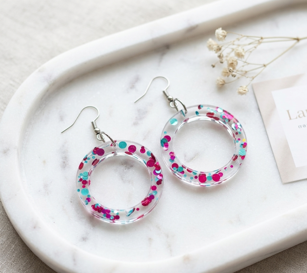 Crystal Clear Confetti Hoop Earrings – clear resin hoops with magenta and teal confetti